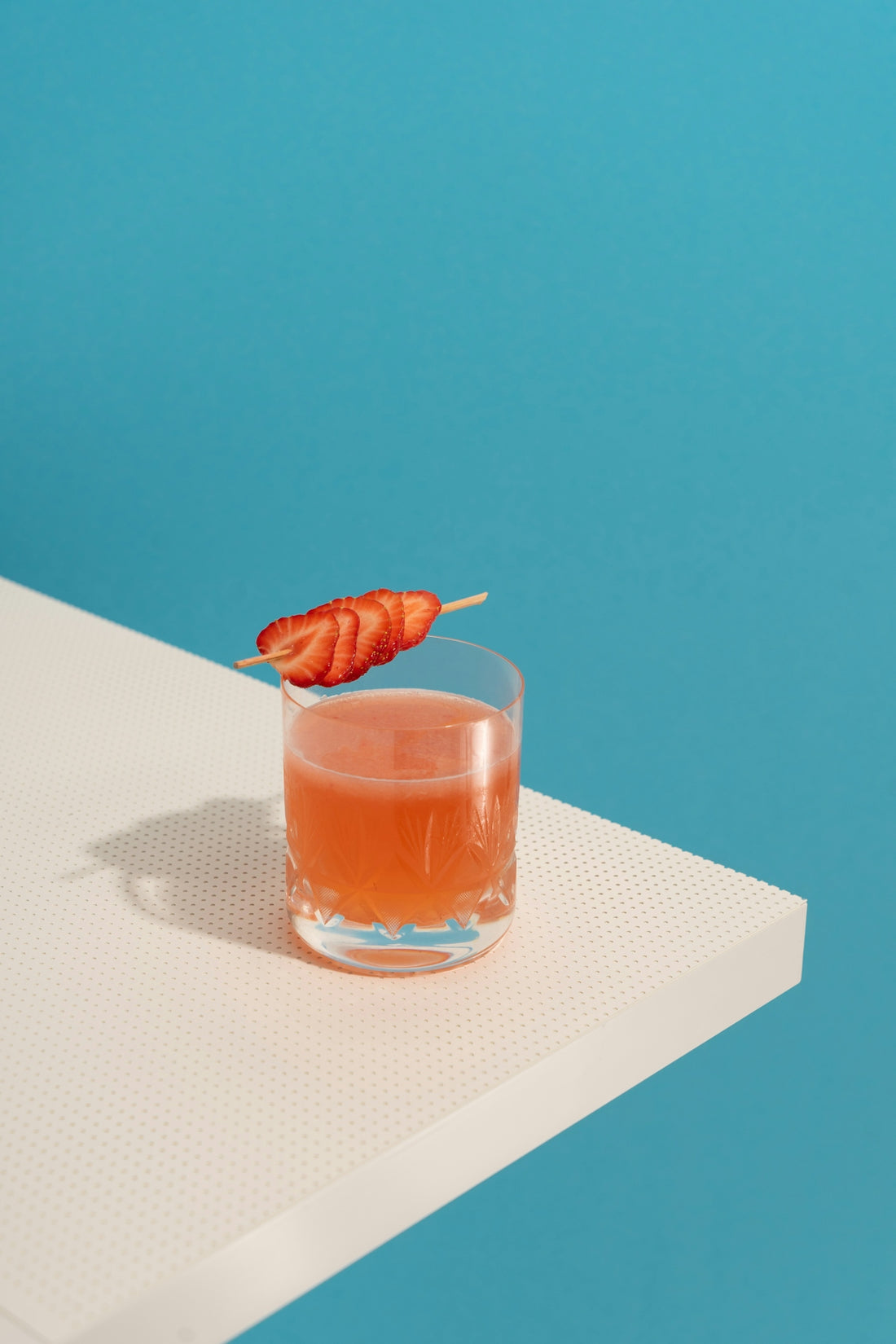 clear drinking glass with brown liquid