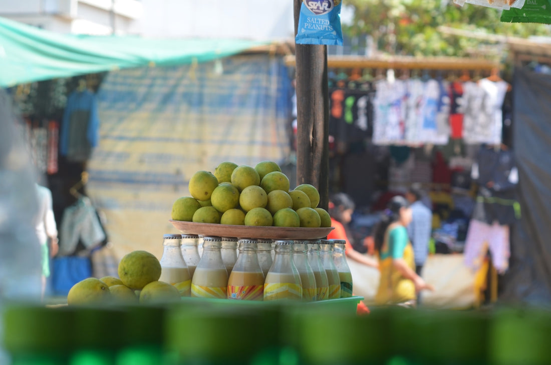 Fresh lemons and bottled drinks at a market stall